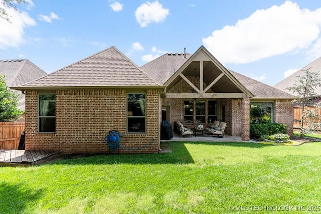 2015 W 109th St, Jenks, OK 74037 - back of house with brick siding, an outdoor hangout area, roof with shingles, and a patio area