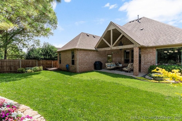 2015 W 109th St, Jenks, OK 74037 - rear view of house with a patio, brick siding, a shingled roof, and outdoor lounge area