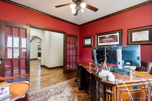2015 W 109th St, Jenks, OK 74037 - home office featuring arched walkways, a ceiling fan, wood finished floors, and ornamental molding