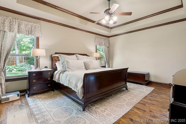 2015 W 109th St, Jenks, OK 74037 - bedroom featuring a raised ceiling, light wood-style flooring, crown molding, and ceiling fan