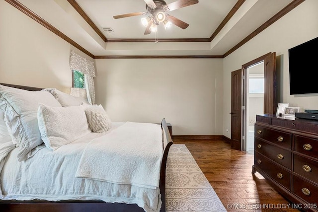 2015 W 109th St, Jenks, OK 74037 - bedroom featuring a tray ceiling, dark wood-type flooring, crown molding, and a ceiling fan