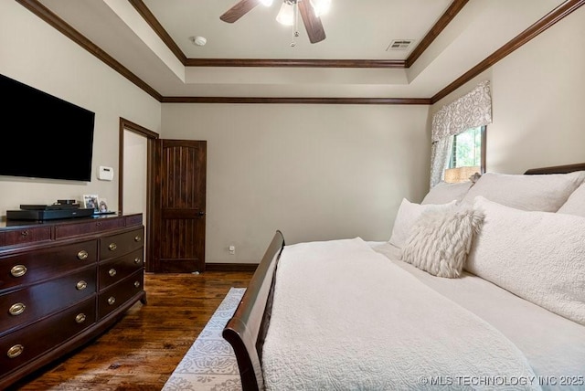 2015 W 109th St, Jenks, OK 74037 - bedroom with a tray ceiling, dark wood-style flooring, crown molding, and ceiling fan