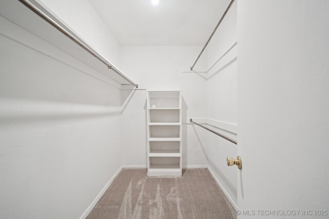 3002 E 80th Pl, Tulsa, OK 74136 - spacious closet featuring carpet flooring