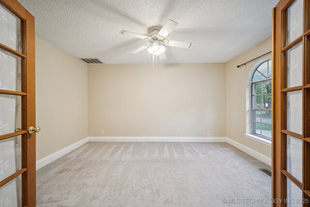 3002 E 80th Pl, Tulsa, OK 74136 - carpeted empty room featuring a textured ceiling and a ceiling fan