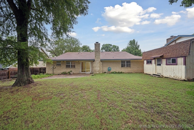3002 E 80th Pl, Tulsa, OK 74136 - back of house with an outbuilding and a chimney