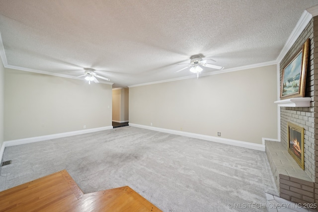 3002 E 80th Pl, Tulsa, OK 74136 - unfurnished living room with ceiling fan, a brick fireplace, carpet floors, a textured ceiling, and ornamental molding