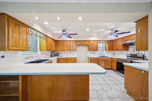 3002 E 80th Pl, Tulsa, OK 74136 - kitchen featuring stainless steel range with electric cooktop, a ceiling fan, under cabinet range hood, a peninsula, and recessed lighting