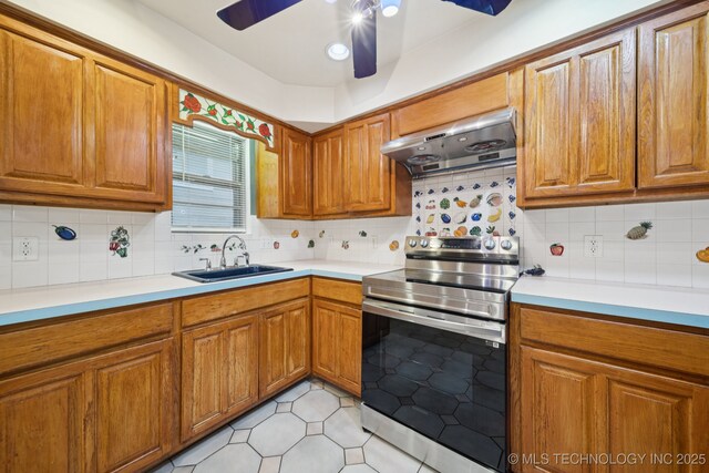 3002 E 80th Pl, Tulsa, OK 74136 - kitchen with electric stove, range hood, and brown cabinets