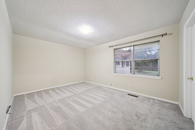 3002 E 80th Pl, Tulsa, OK 74136 - spare room with carpet flooring and a textured ceiling