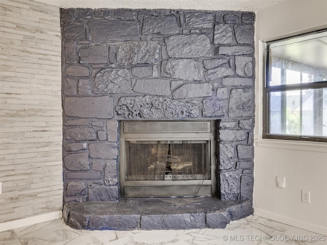 314 N Tallchief St, Skiatook, OK 74070 - detailed view of baseboards and a fireplace