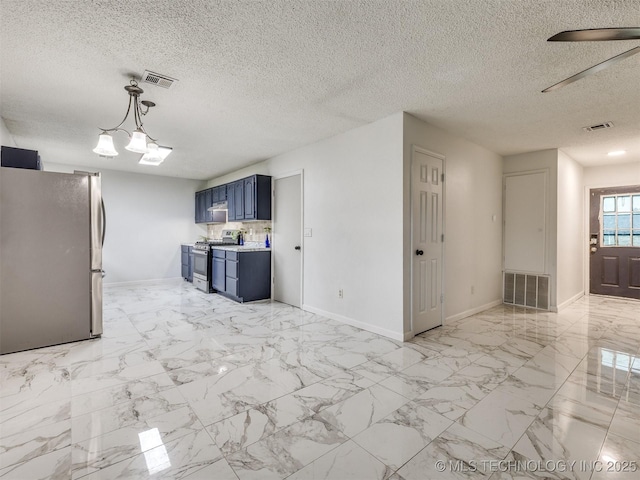 314 N Tallchief St, Skiatook, OK 74070 - kitchen with stainless steel appliances, blue cabinetry, light countertops, a textured ceiling, and a ceiling fan