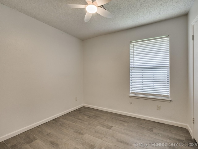 314 N Tallchief St, Skiatook, OK 74070 - unfurnished room featuring ceiling fan, wood finished floors, and a textured ceiling