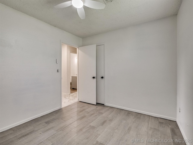 314 N Tallchief St, Skiatook, OK 74070 - empty room featuring a ceiling fan, wood finished floors, and a textured ceiling