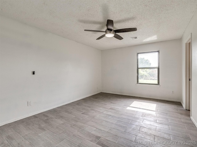 314 N Tallchief St, Skiatook, OK 74070 - spare room with ceiling fan, a textured ceiling, and wood finished floors