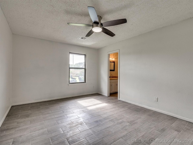 314 N Tallchief St, Skiatook, OK 74070 - unfurnished room with ceiling fan, a textured ceiling, and wood finished floors