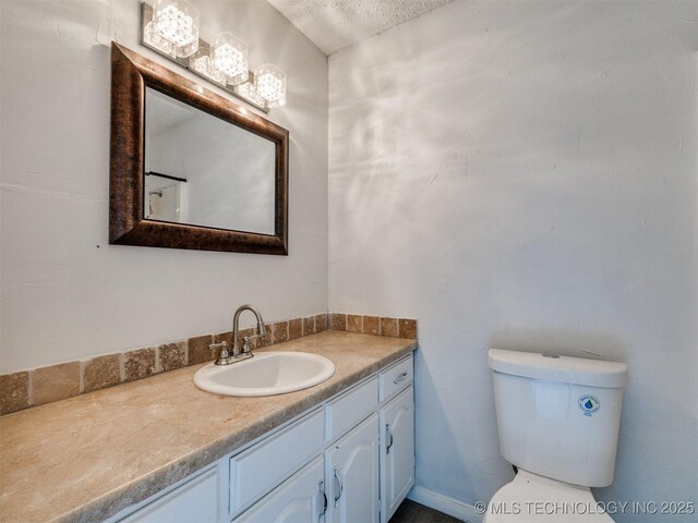 314 N Tallchief St, Skiatook, OK 74070 - bathroom with vanity and a textured ceiling