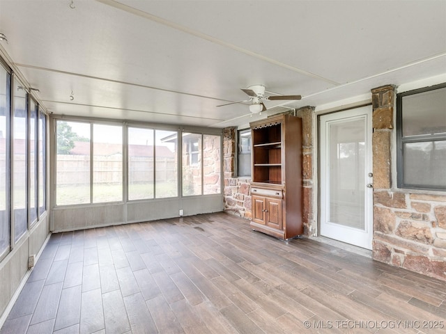 314 N Tallchief St, Skiatook, OK 74070 - unfurnished sunroom with a ceiling fan, wood finished floors, and plenty of natural light