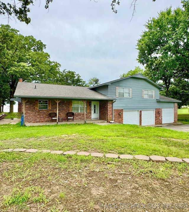 115842 S 4196, Checotah, OK 74426 - split level home with brick siding, driveway, a garage, and a front lawn