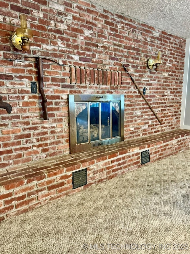 115842 S 4196, Checotah, OK 74426 - detailed view of carpet flooring, a textured ceiling, and brick wall