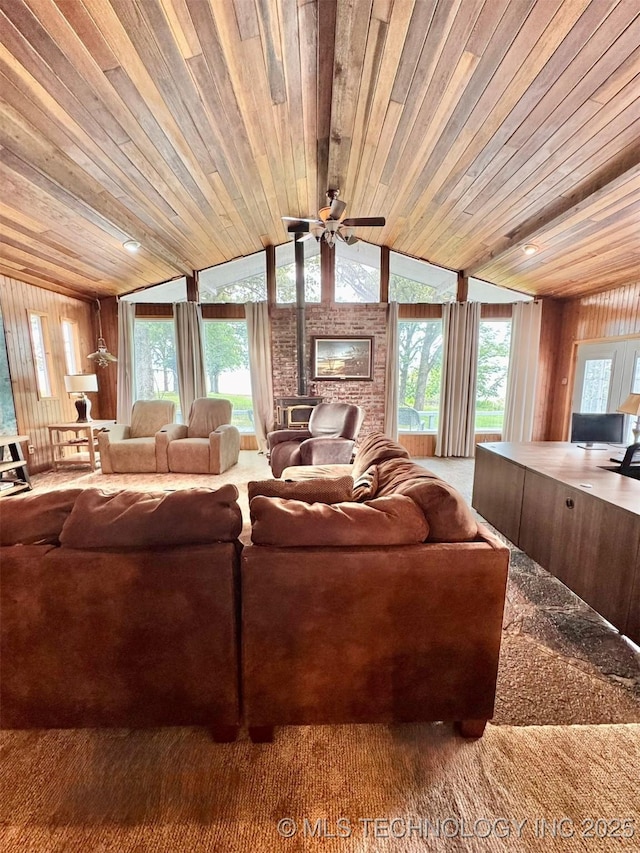 115842 S 4196, Checotah, OK 74426 - living area featuring wood ceiling, vaulted ceiling, carpet flooring, ceiling fan, and wooden walls