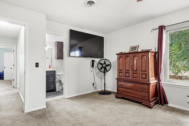 2605 W Atlanta Ct, Broken Arrow, OK 74012 - carpeted bedroom featuring multiple windows and ensuite bath