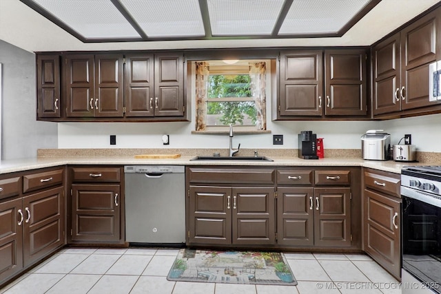 2605 W Atlanta Ct, Broken Arrow, OK 74012 - kitchen with dishwasher, range, light tile patterned flooring, and light countertops