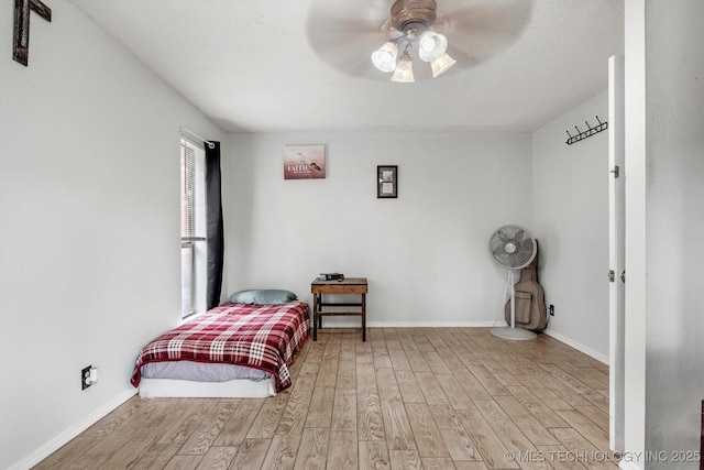 2605 W Atlanta Ct, Broken Arrow, OK 74012 - bedroom with wood finished floors and a ceiling fan