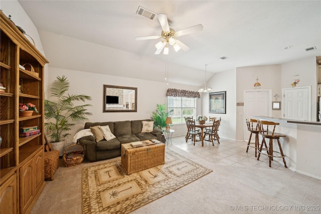 1101 S Yellowood Ave, Broken Arrow, OK 74012 - living room featuring lofted ceiling, light carpet, a ceiling fan, light tile patterned floors, and a chandelier