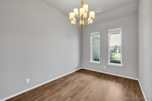 2012 W Huntsville Pl, Broken Arrow, OK 74011 - unfurnished room featuring dark wood-style floors and a chandelier