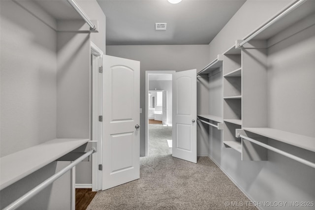 2012 W Huntsville Pl, Broken Arrow, OK 74011 - spacious closet with dark colored carpet