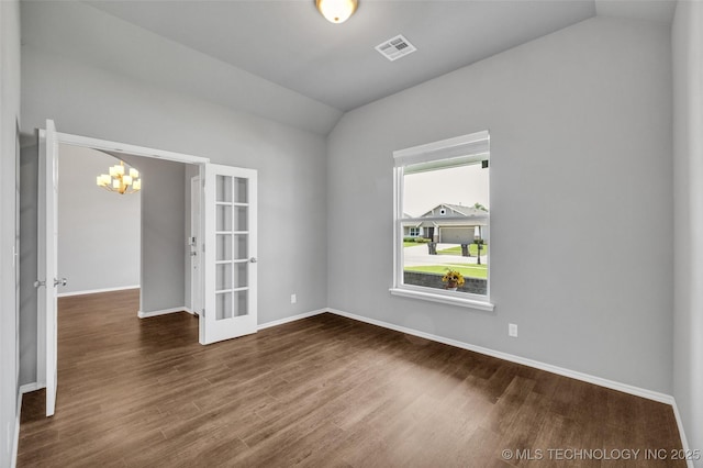 2012 W Huntsville Pl, Broken Arrow, OK 74011 - empty room with lofted ceiling, dark wood-style floors, a chandelier, and french doors