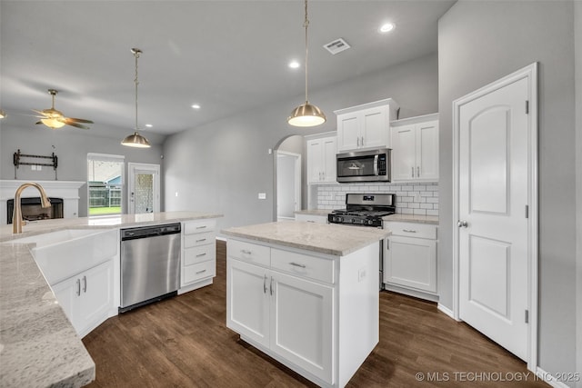 2012 W Huntsville Pl, Broken Arrow, OK 74011 - kitchen featuring appliances with stainless steel finishes, decorative backsplash, dark wood-style flooring, a ceiling fan, and recessed lighting