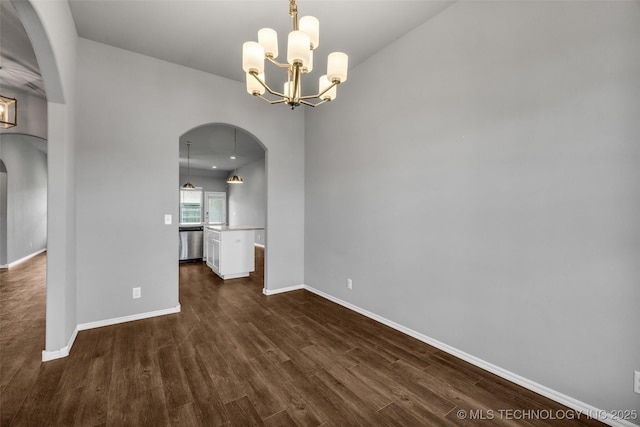 2012 W Huntsville Pl, Broken Arrow, OK 74011 - unfurnished room featuring arched walkways, dark wood-style flooring, and a chandelier