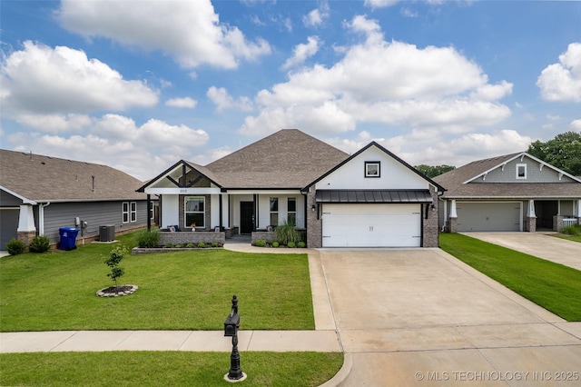 2012 W Huntsville Pl, Broken Arrow, OK 74011 - view of front of home with a porch, an attached garage, a front lawn, driveway, and board and batten siding