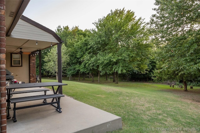 14701 E 150th St, Collinsville, OK 74021 - view of grassy yard with a patio area