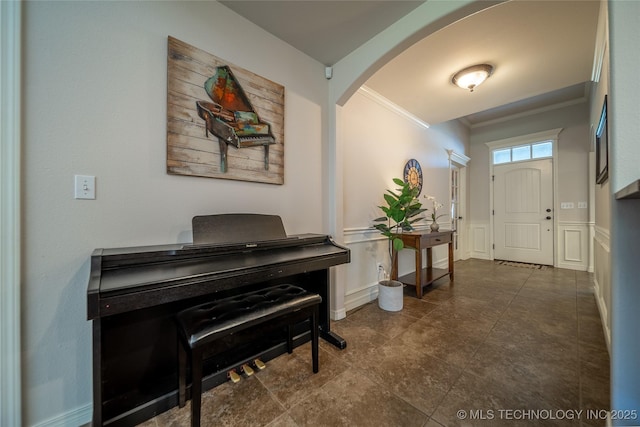 14701 E 150th St, Collinsville, OK 74021 - entryway with ornamental molding, arched walkways, and a wainscoted wall