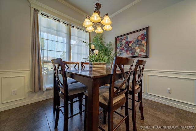 14701 E 150th St, Collinsville, OK 74021 - dining room featuring a chandelier, ornamental molding, dark tile patterned flooring, wainscoting, and a decorative wall