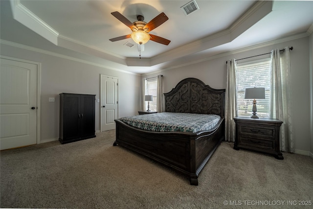 14701 E 150th St, Collinsville, OK 74021 - bedroom featuring a tray ceiling, light colored carpet, crown molding, and a ceiling fan