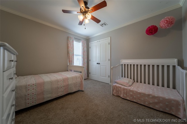 14701 E 150th St, Collinsville, OK 74021 - bedroom with carpet flooring, crown molding, a closet, and a ceiling fan