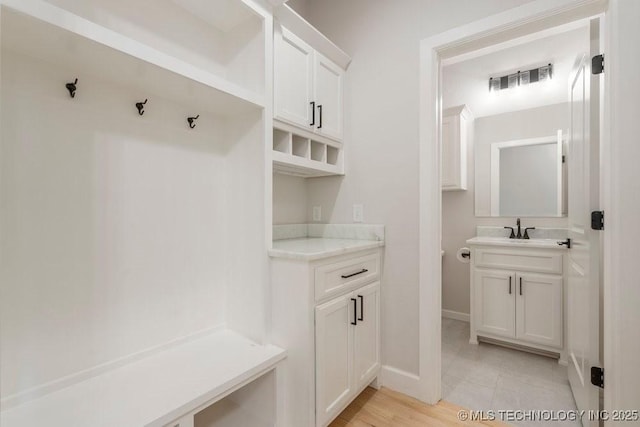5918 E 126th Pl S, Bixby, OK 74008 - mudroom featuring a sink and baseboards
