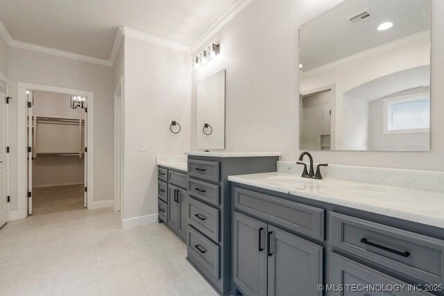 5918 E 126th Pl S, Bixby, OK 74008 - full bathroom featuring vanity, a walk in closet, crown molding, and tile patterned flooring