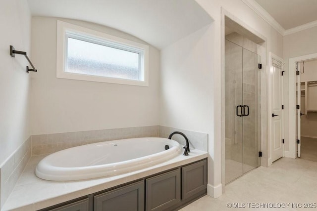 5918 E 126th Pl S, Bixby, OK 74008 - bathroom with a garden tub, a stall shower, a spacious closet, crown molding, and tile patterned flooring