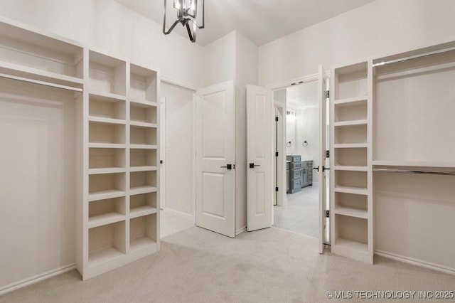 5918 E 126th Pl S, Bixby, OK 74008 - walk in closet with carpet flooring and a chandelier