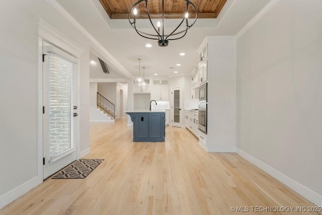 5918 E 126th Pl S, Bixby, OK 74008 - kitchen featuring a chandelier, a raised ceiling, appliances with stainless steel finishes, wooden ceiling, and white cabinets