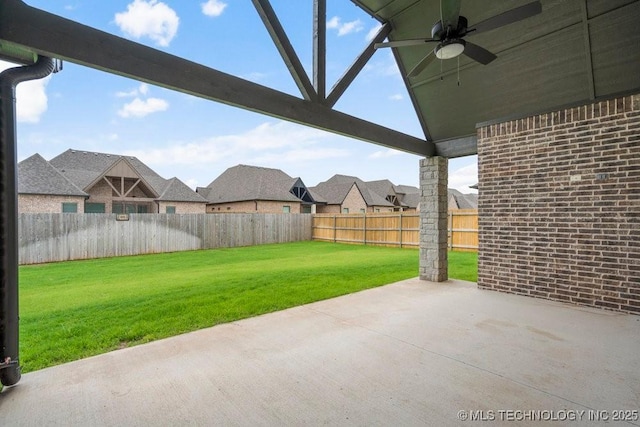 5918 E 126th Pl S, Bixby, OK 74008 - fenced backyard with a ceiling fan and a patio