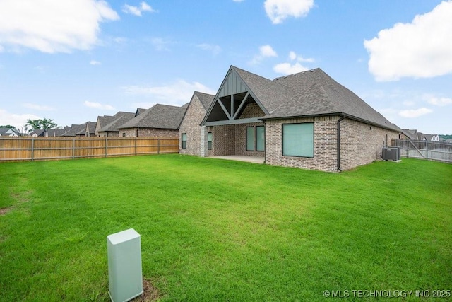 5918 E 126th Pl S, Bixby, OK 74008 - rear view of property featuring a fenced backyard, brick siding, and roof with shingles