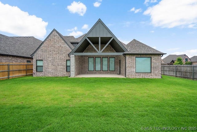 5918 E 126th Pl S, Bixby, OK 74008 - back of property with brick siding, a fenced backyard, a patio area, and a shingled roof