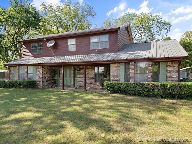 311 Washington Ave, Boswell, OK 74727 - view of front of property with brick siding, a front lawn, and a metal roof