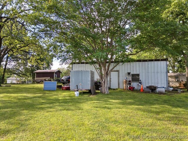 311 Washington Ave, Boswell, OK 74727 - view of green lawn with an outbuilding