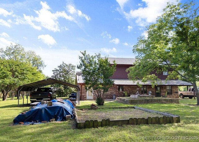 311 Washington Ave, Boswell, OK 74727 - view of green lawn with a detached carport